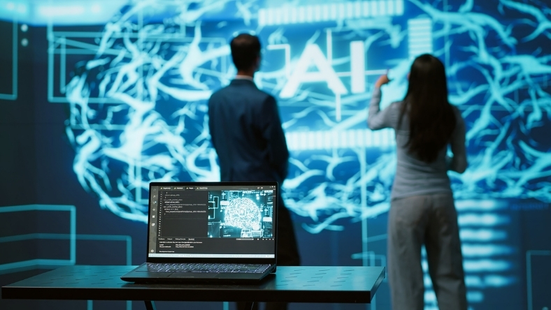 Researchers reviewing artificial intelligence models displayed on a digital screen